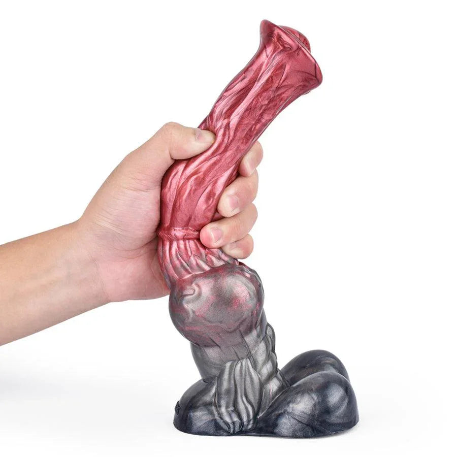 A hand holding a 10-inch realistic horse dildo by Xinghaoya in red and grey.