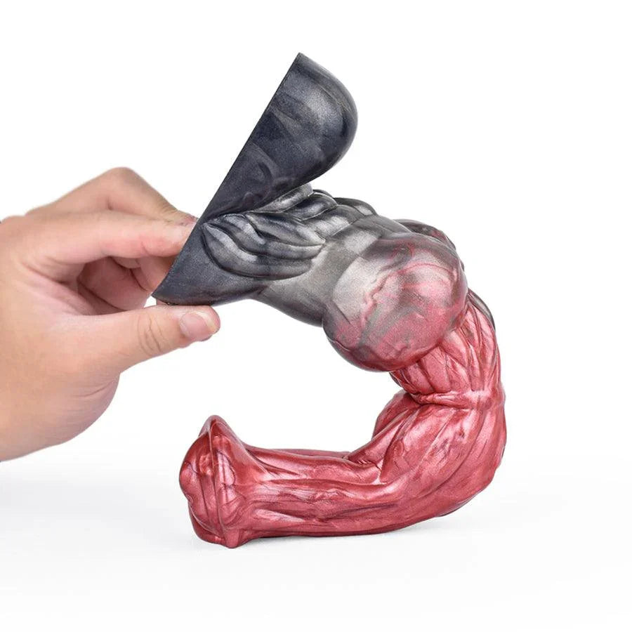 A hand holding a realistic 10 inch huge horse dildo by Xinghaoya with a red and grey gradient.